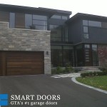 overhead garage doors replacement project featuring custom cedar wood panels installed in Toronto