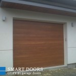 Custom smooth cedar Wood Garage door installed North York