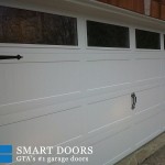 White carriage style overhead garage doors installed in Woodbridge