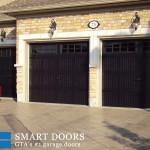 Carriage style barn garage doors installed in concord with glass inserts