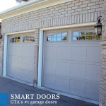 carriage style garage door with window installed in North York