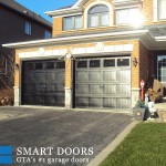 black barn style overhead panel garage door installed by smart door