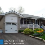 White Carriage Style overhead Garage door installed by smart doors concord