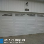 Overhead garage doors replaced with raised panel doors