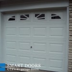 Garage door replaced at Toronto home with New raised panel overhead door in white color