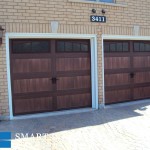 Toronto installation of wood tone overhead garage doors