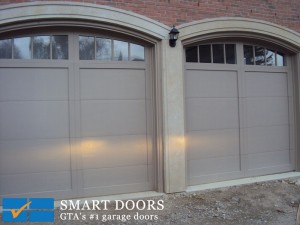 Arched bay fiberglass overlay steel frame garage doors installed in Vaughan