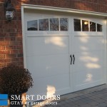overlay panel garage doors with window insert installed in North York home