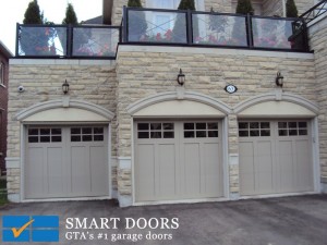 Markham home got Three carriage style garage doors with lites