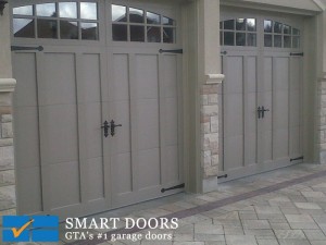 barn style steel garage doors with windows installed in North York