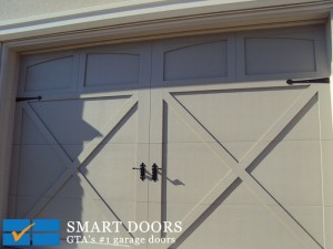 Carriage barn style steel frame garage door installed in Toronto