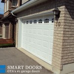 white Raised panel Garage Door with windows installed in Markham home