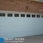 Double Raised panel Garage doors with window inserts installed in Markham home