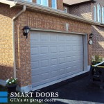 Short raised panel Garage doors installed in Toronto home