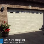 Short raised panel Garage doors with windows installed in Toronto home by Smart Doors