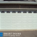 White raised panel garage door with window installed in Markham