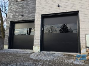 Modern design flush black garage door installed in Maple