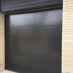 Modern Flush black overhead garage door installed in Toronto by smart doors