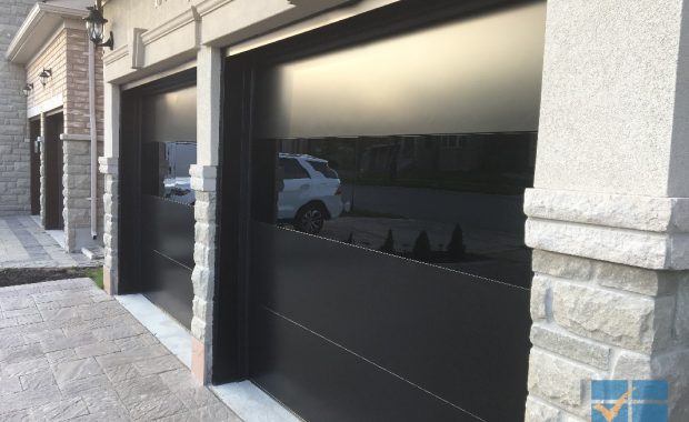 Modern Flush black overhead garage door replacement in Maple