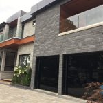 Glossy black Glass Garage doors installed in Markham near Toronto