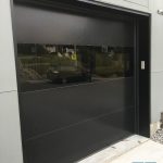 Smooth Finish panel black garage door installed in Maple