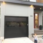 Matt black flush panel garage door installed in beaches, Maple