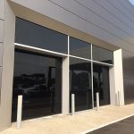Commercial Garage Doors Installation in Toronto featuring Pair of two glass Garage Doors