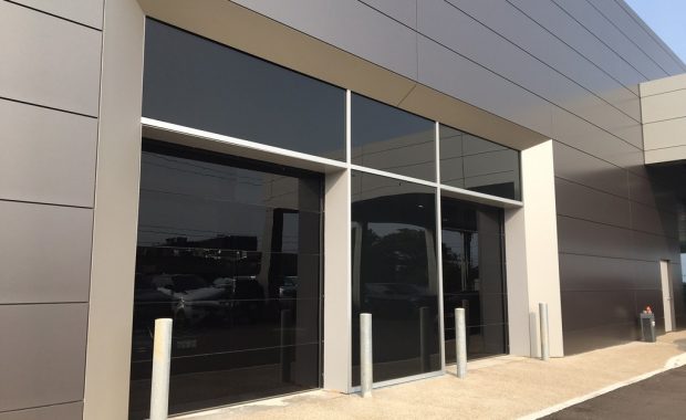 Commercial Garage Doors Installation in Toronto featuring Pair of two glass Garage Doors