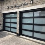 Contemporary Aluminum & Clear Tempered Glass Garage Door installed in Toronto