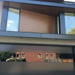 Smooth Black Glass Garage Doors Installation In Toronto