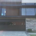 Modern Black Glass Garage Doors Installation In Toronto