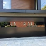 Smooth Black flush panel Glass Garage Doors Installation In Toronto