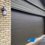 Garage Doors replacement in Toronto featuring black flush panel overhead doors