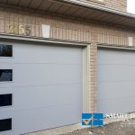 Overhead Garage Doors Installations in Toronto featuring Matt grey flush panel doors
