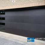 Overhead Garage Doors installation in Toronto featuring flush panel style doors with windows