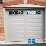 Overhead Garage Doors installation in Toronto featuring classic raised panel style doors