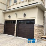 Overhead Garage Doors installation in Toronto featuring twin flush panel doors in faux wood finish