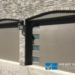 Overhead Garage Doors replacement in Toronto featuring flush panel door in matt grey texture