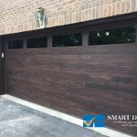 Overhead garage doors replacement in Toronto featuring flush panel door with window in wood texture