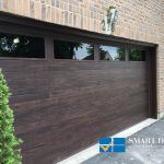 overhead Garage Doors replacement in Toronto featuring flush panel door in wood texture