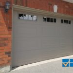 Overhead Garage Doors Installations in Toronto featuring grey raised panel door with window