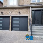 overhead Garage Doors Installations in Toronto featuring pair of two flush panel doors with windows