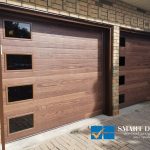 Custom Garage Doors Installations in Toronto featuring flush panel doors with wooden texture