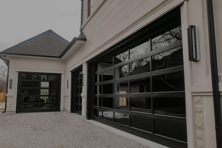 aluminum and glass garage doors being installed by smart doors